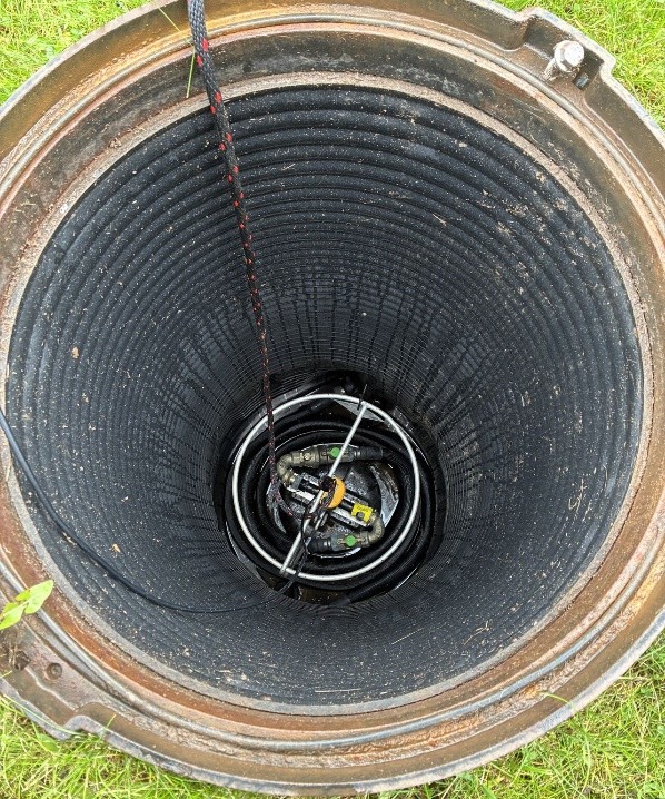 The smart water meter located two meters deep inside the manhole, a challenging 'grey zone' for connectivity